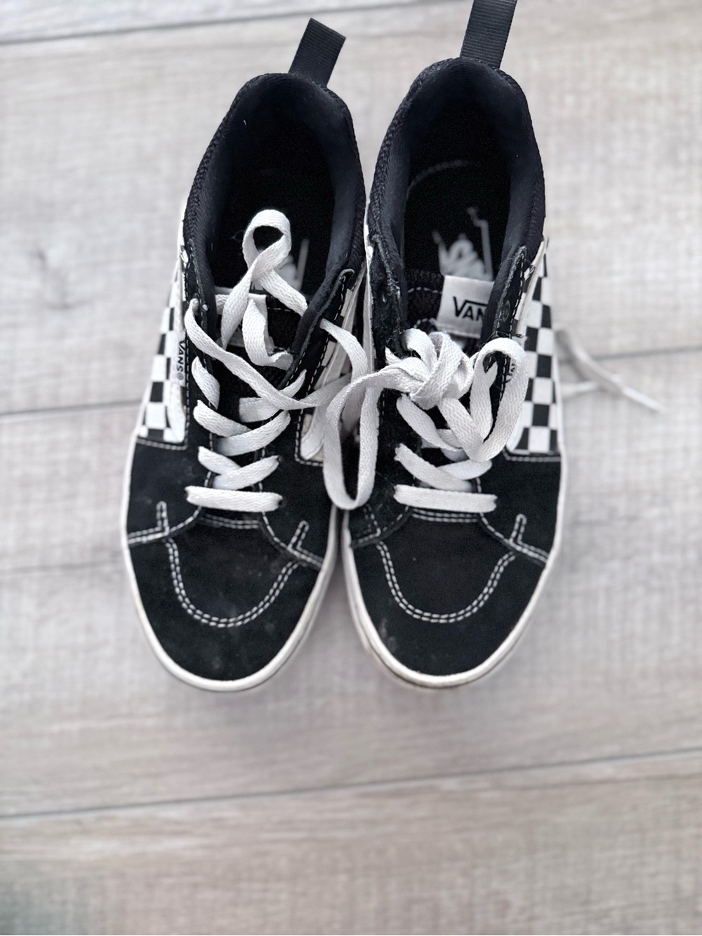 Black with checkered Vans